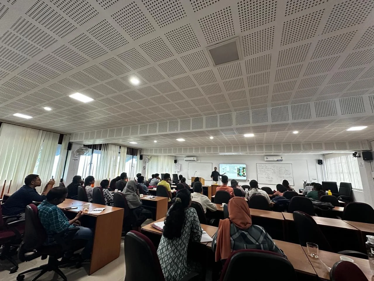 Attending lecture sessions at the workshop
